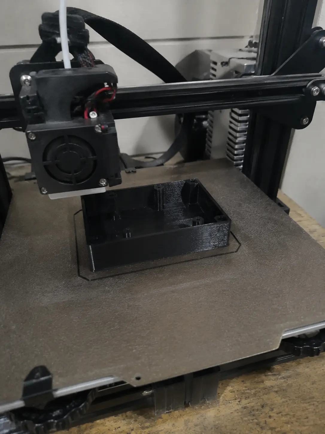 3D printed part next to flame retardant filament spool