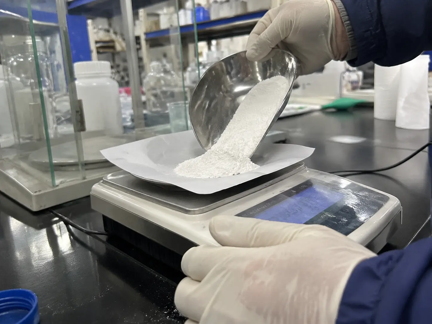 Weighing antimony trioxide synergist for a brominated flame retardant formulation